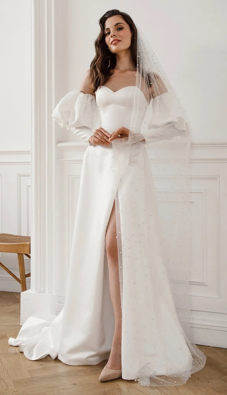 A Minimalist Princess Wedding Dress with Dramatic Sleeves