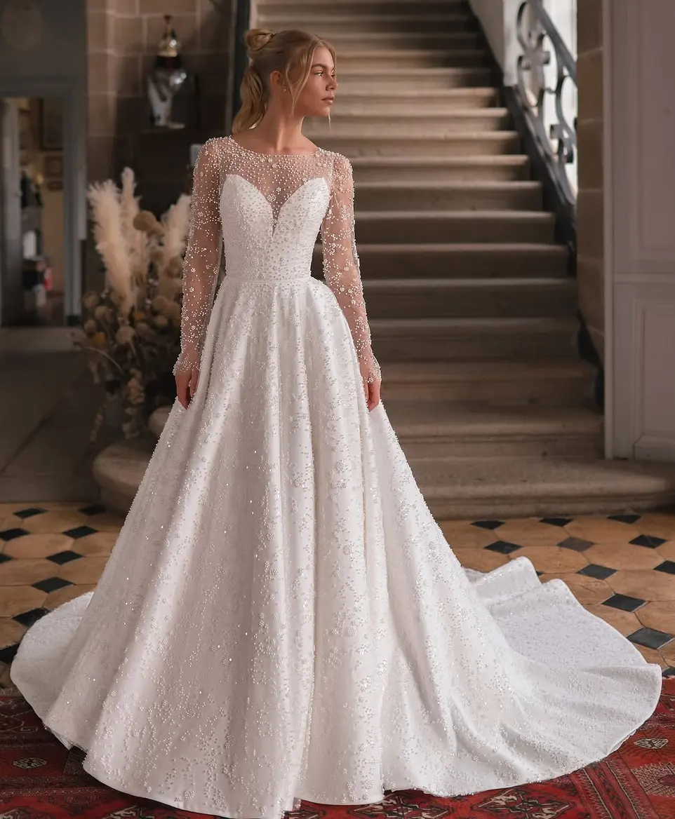 A Pearl-Kissed Princess Wedding Dress with Sheer Elegance