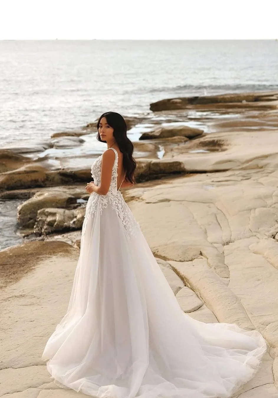 Ocean’s Embrace A Flowing Tulle Beach Wedding Gown